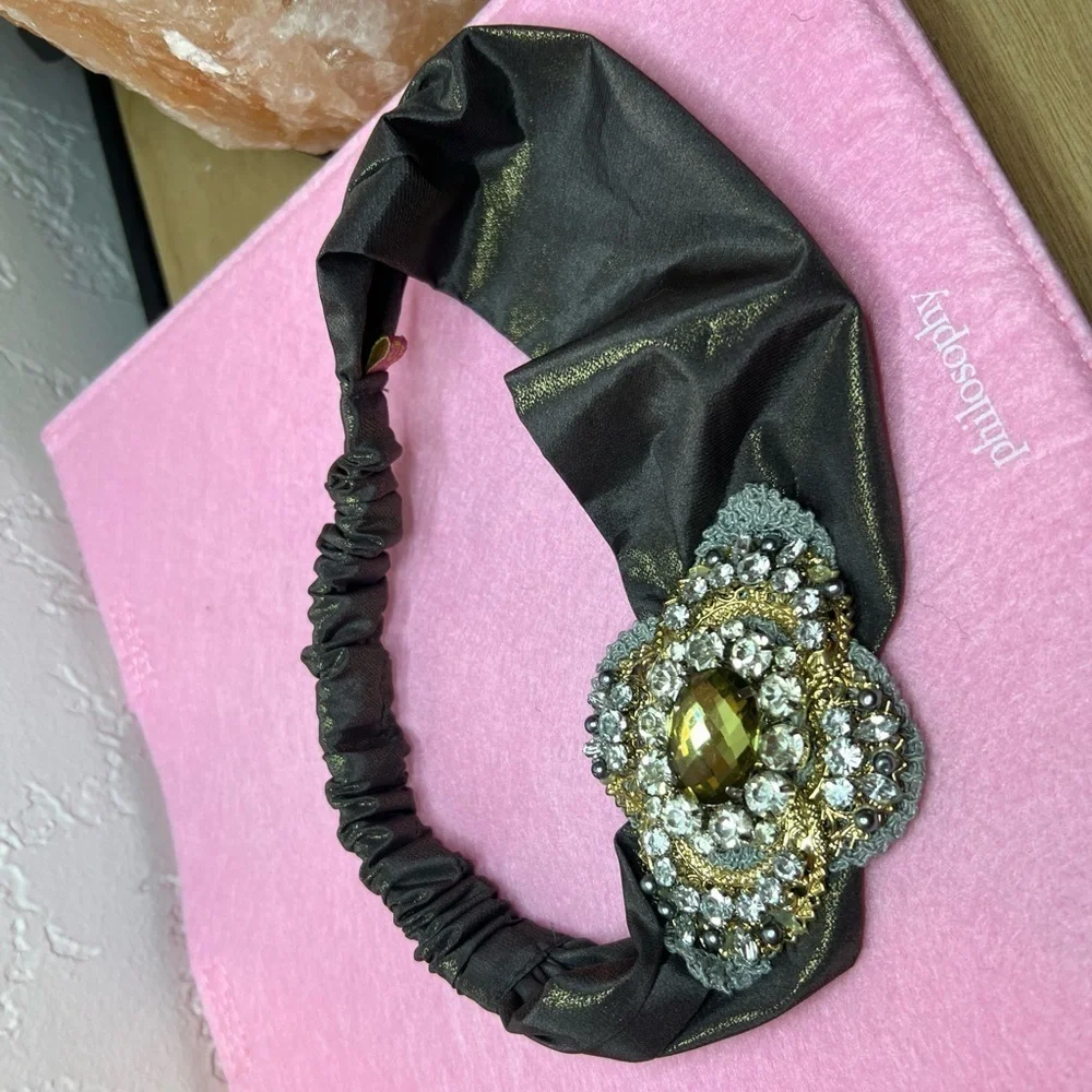 Headband, sparkling fabric and stunning brooch